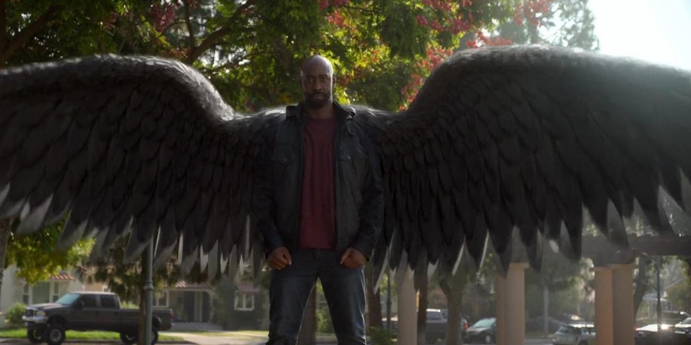 Amenadiel standing with his wings stretched out in a still from Lucifer