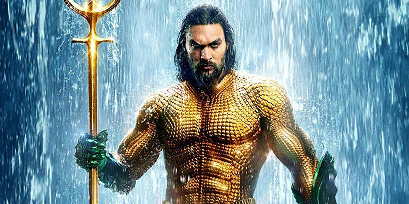 Aquaman holding the Trident of Atlan while standing in front of a waterfall