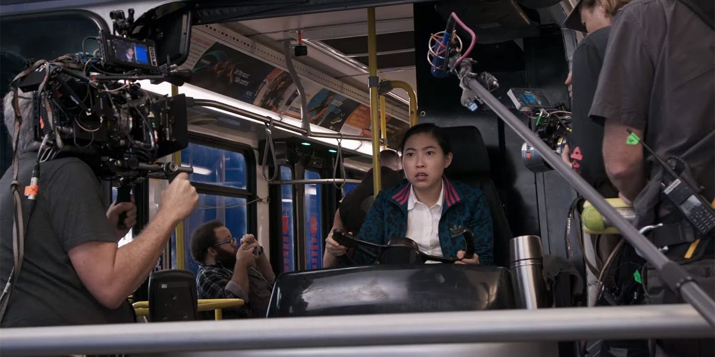 Awkwafina on the set of the bus in a Shang-Chi featurette