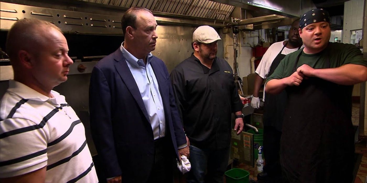Jon Taffer with the employees from the bar in the Hole in None episode of Bar Rescue
