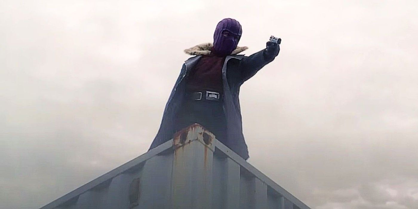 Baron Zemo holds out a gun in his mask for the first time