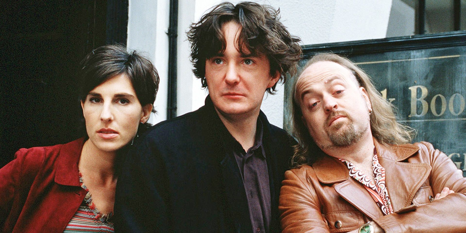 Bernard, Manny, and Fran standing outside the bookshop in Black Books