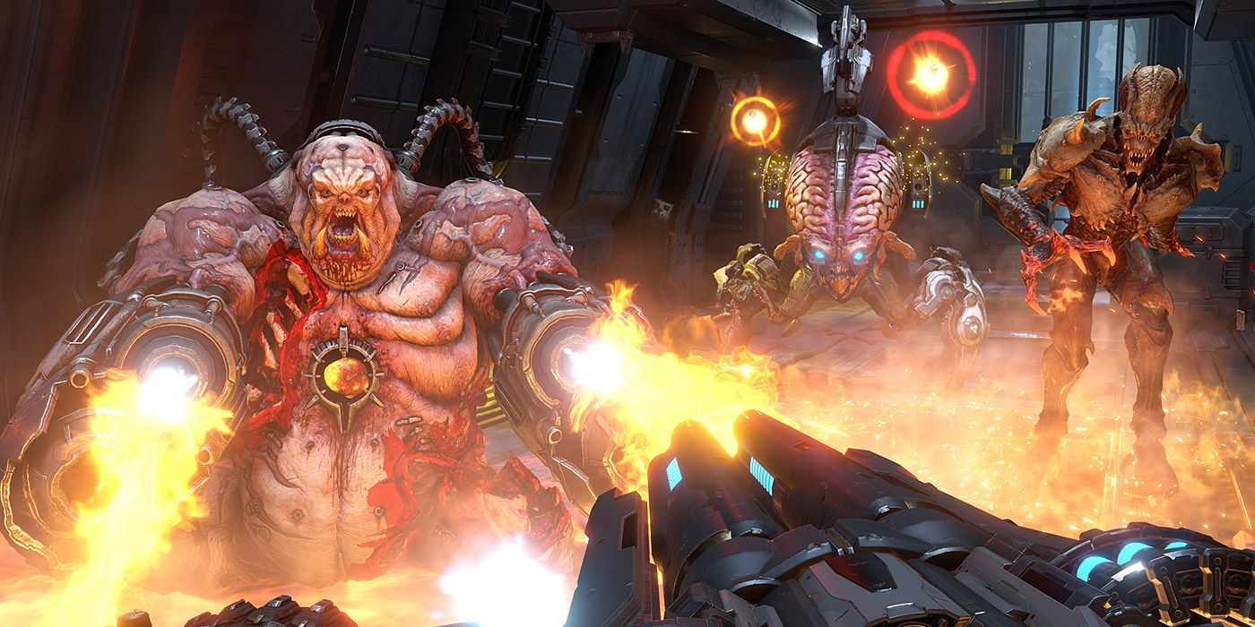 The Doom Slayer battles a Mancubus, Arachnotron and Arch-Vile in Doom Eternal