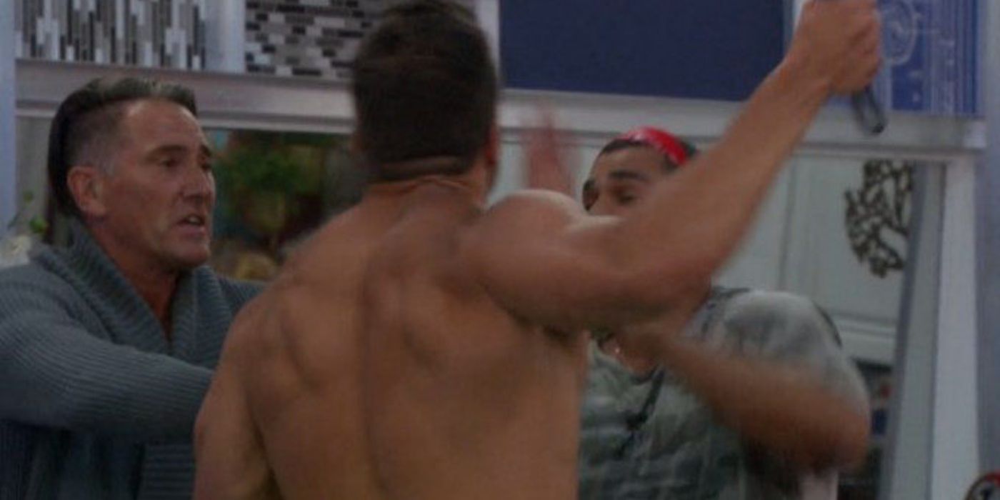 Josh holding the pans and threatenind Mark in Big Brother