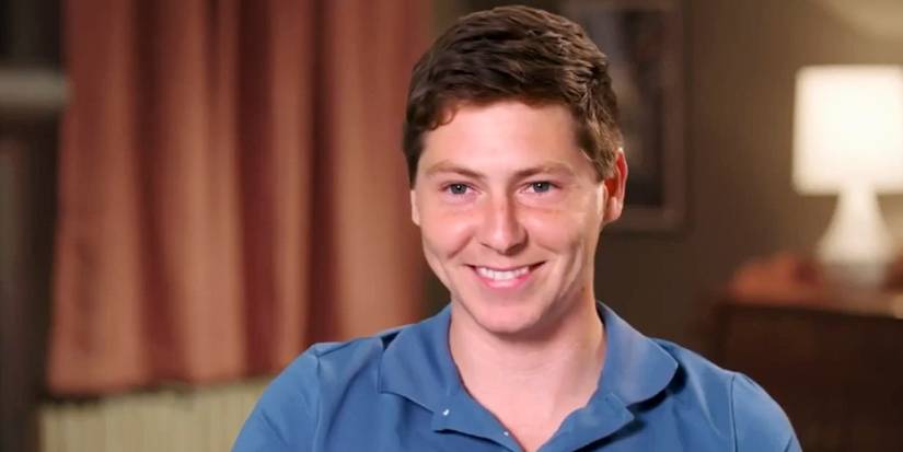 Brandon Gibbs 90 Day Fiance smiling in blue shirt