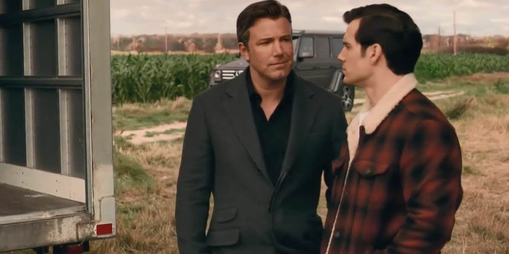 Bruce Wayne and Clark Kent look at each other on the farm in Justice League