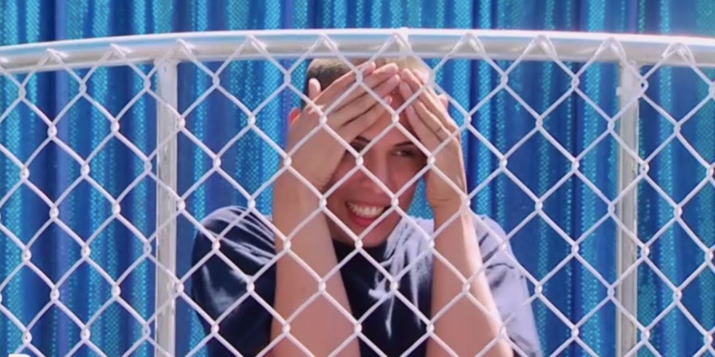 An image of Carmen Carrera behind a cage in RuPaul's Drag Race
