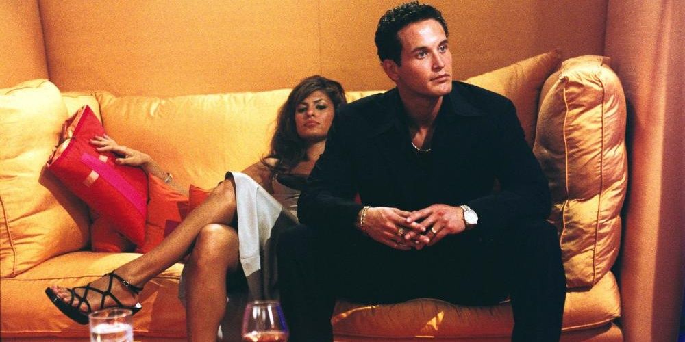 Cole Hauser and Eva Mendes sitting on couch in 2 Fast 2 Furious