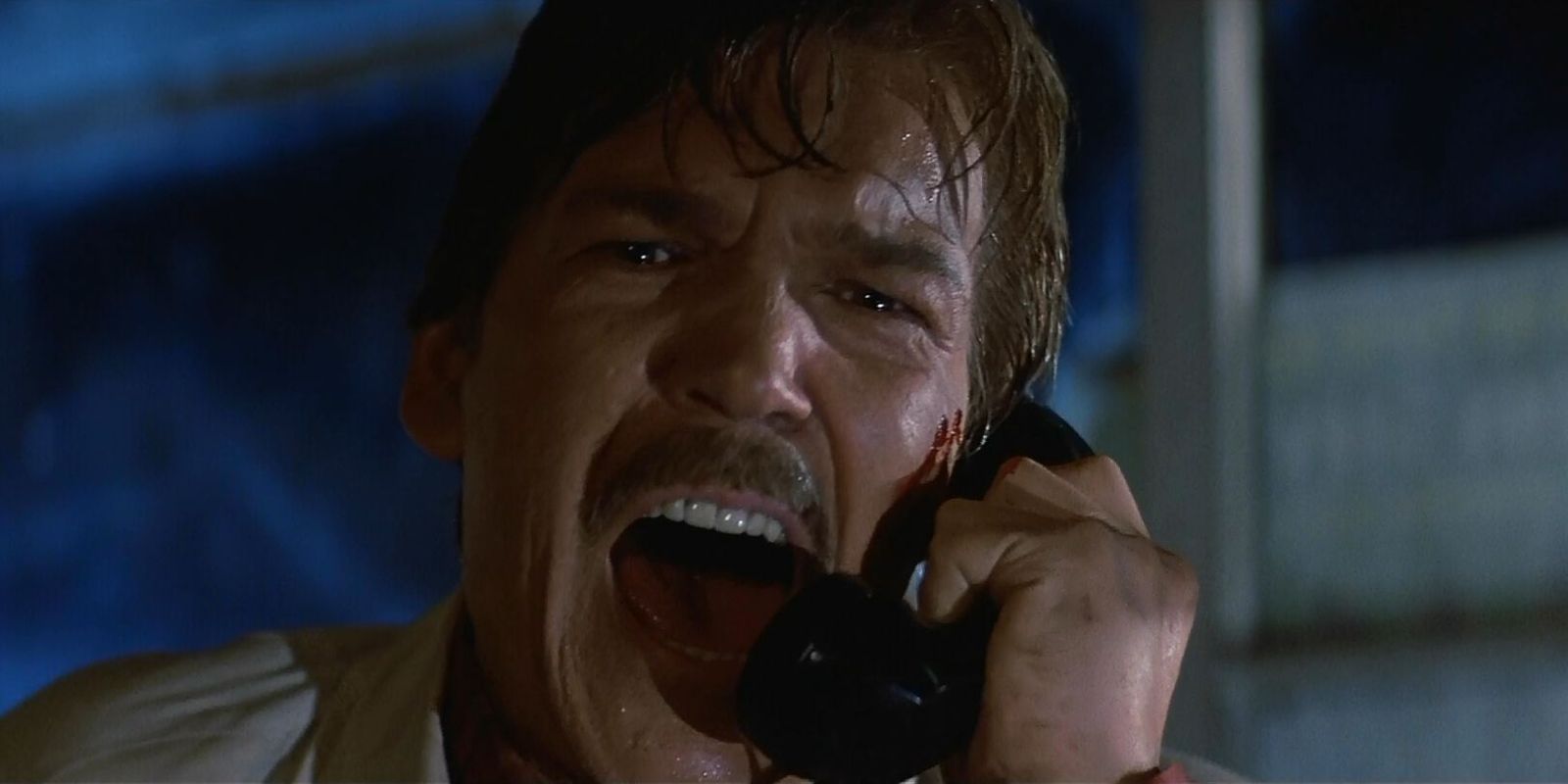 Challis yelling into the microphone in Halloween III: Season Of The Witch