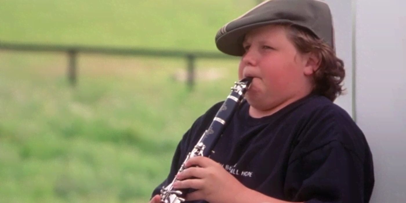 Hnery playing the flute in Cheaper by the Dozen