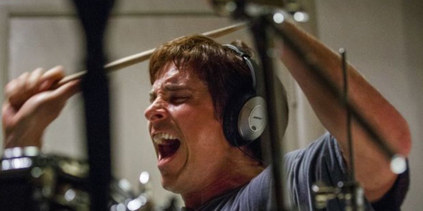 Christian Bale playing drums in The Big Short.