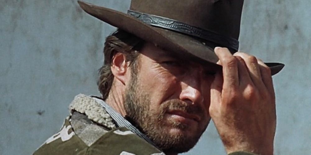 Clint Eastwood in A Fistful of Dollars, tipping his hat to someone