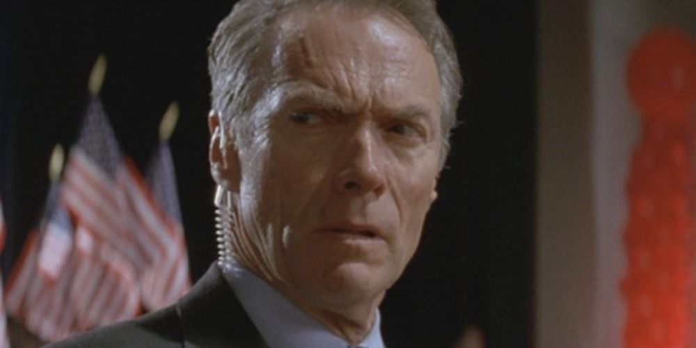Clint Eastwood in In The Line Of Fire, looking to the side with worry