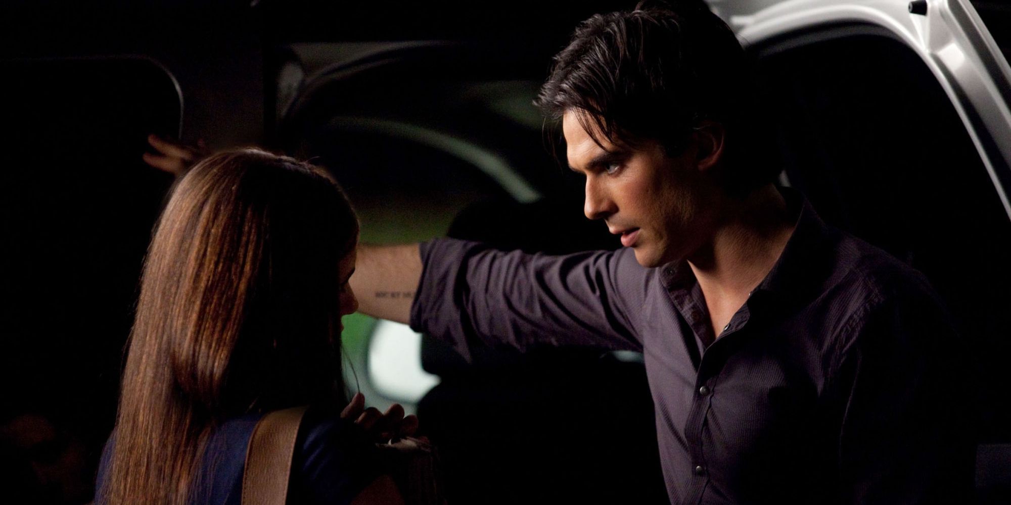 Elena and Damon outside the car in The Vampire Diaries.