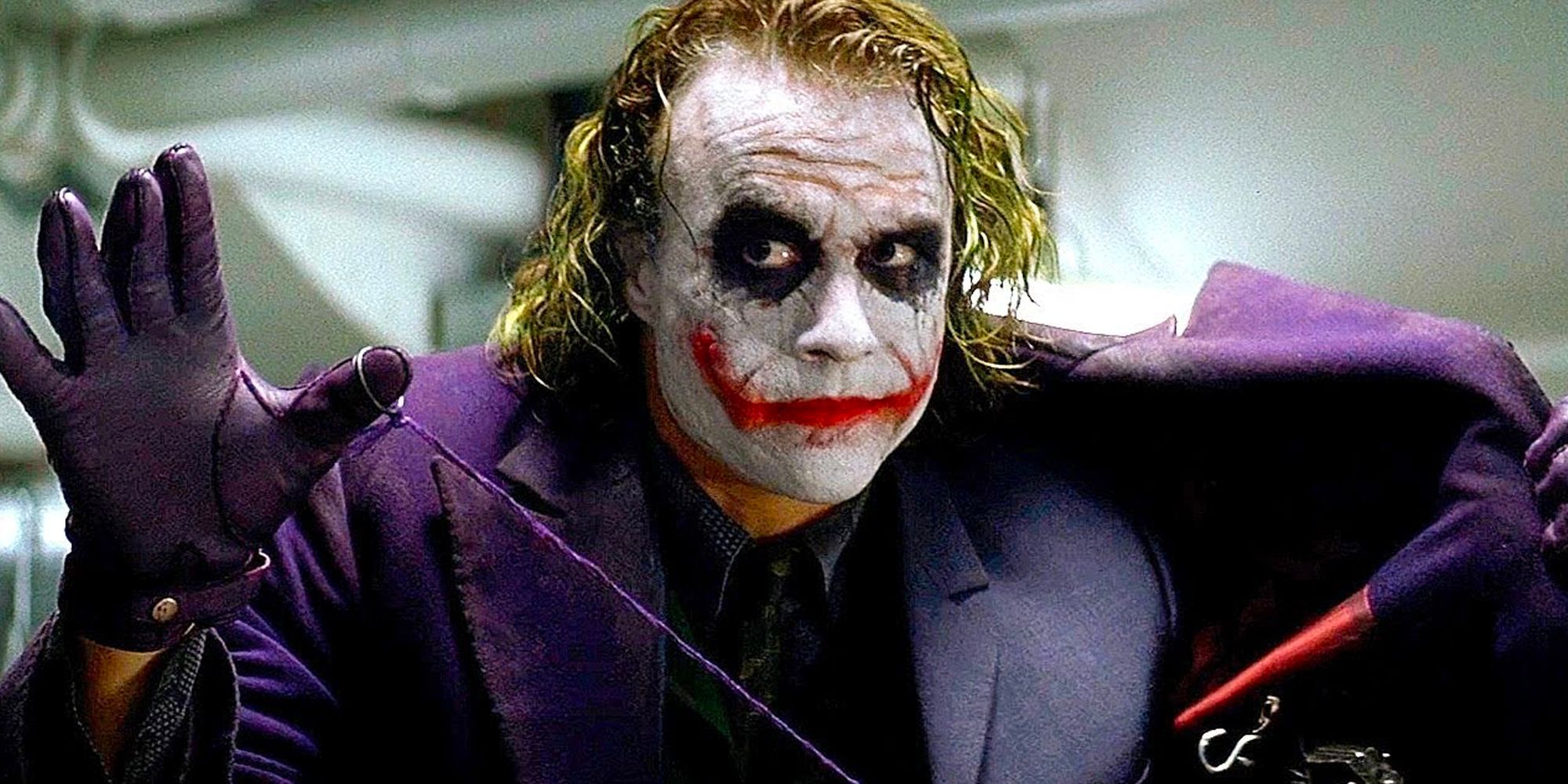 Joker showing a bomb inside his jacket in The Dark Knight.