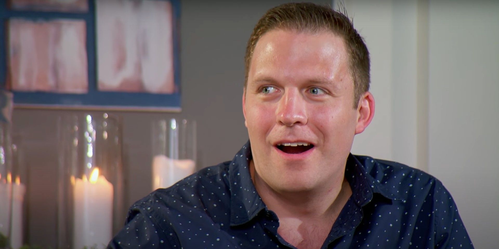David Norton Married At First Sight mouth open posing with candles in background