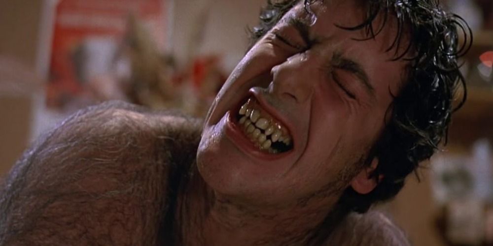 David in American Werewolf in London groaning in pain as he transforms