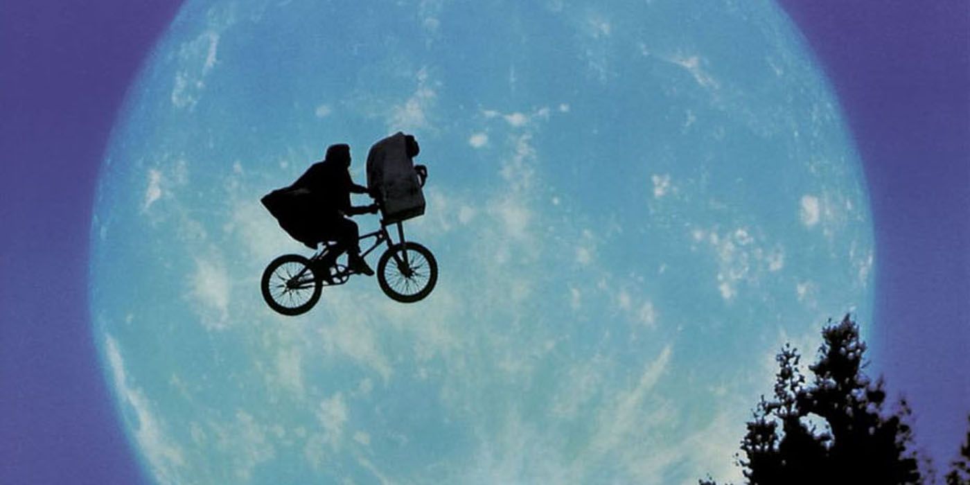 ET and Elliot flying across the moon on their bike.