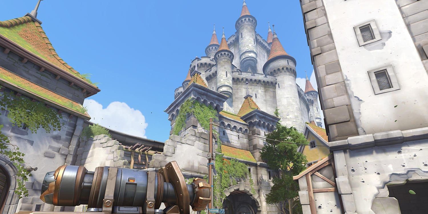 A large German castle seen from a nearby town in Overwatch's Eichenwalde map