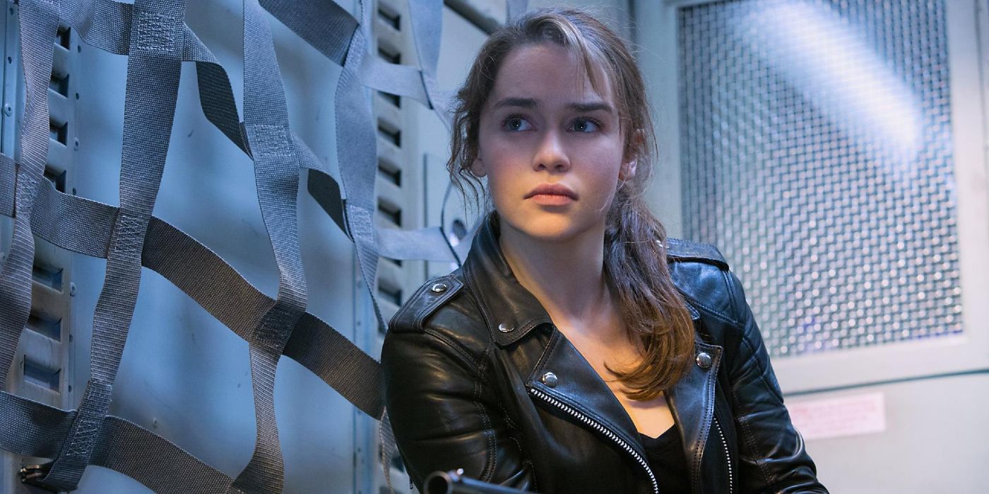 Sarah Conner stands against the wall and listens in Terminator: Genisys