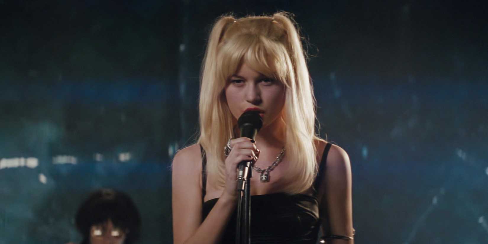 Envy Adams sings onstage while glaring at the audience in Scott Pilgrim vs. the World.