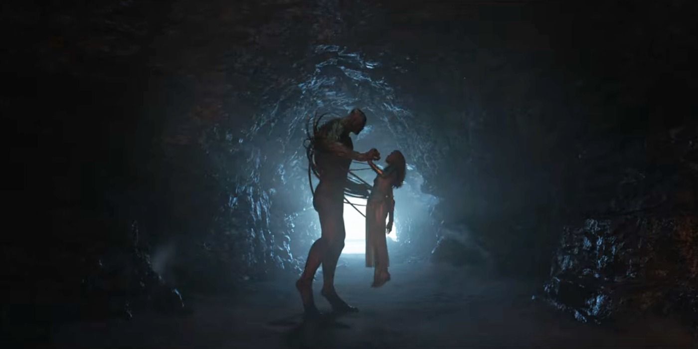 Kro lifts a captive Thena by his tentacles in a dark cave in Marvel's Eternals.