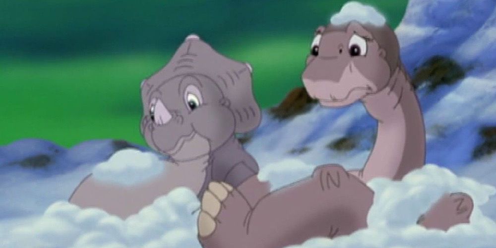 Littlefoot and Cera fall in the snow in The Land Before Time VIII: The Big Freeze