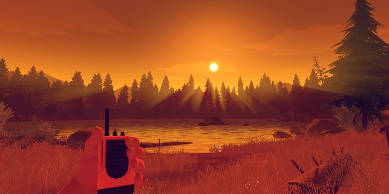 A player holds a walkie talkie as they look at the setting sun in the Switch game Firewatch.