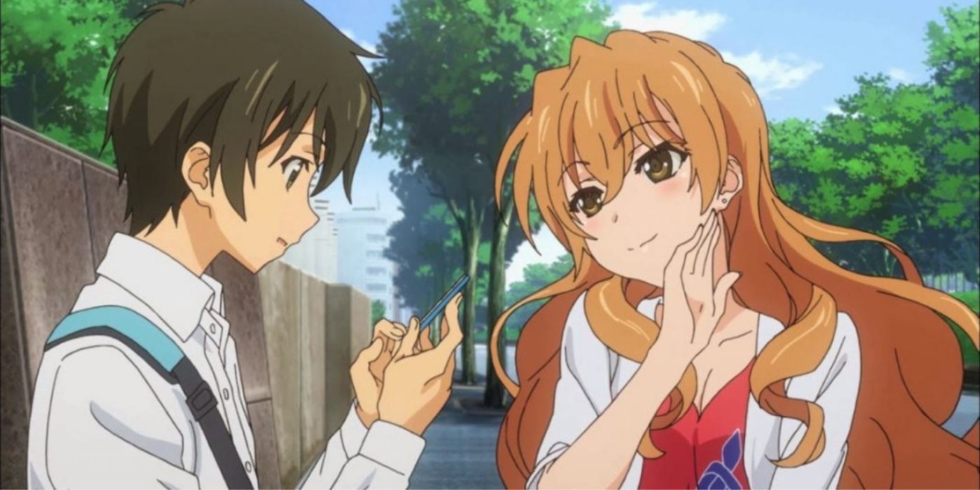 A female character smiles at a male in the Golden Time anime