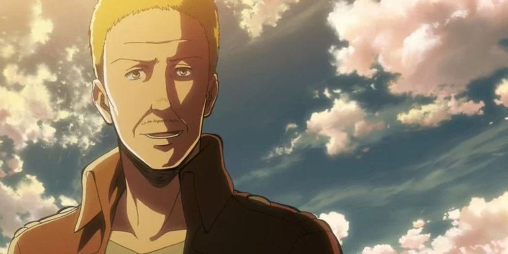 Hannes from Attack on Titan smiling under a clear blue sky