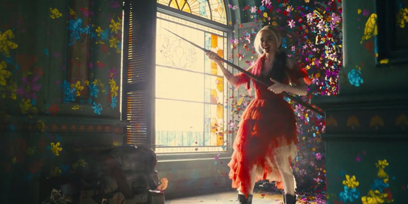 Harley Quinn holds a javelin as flowers surround her in The Suicide Squad