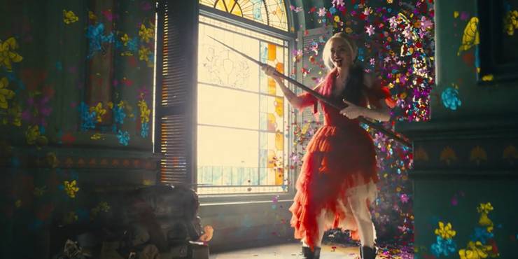 Harley in the Suicide Squad move surrounded by flowers