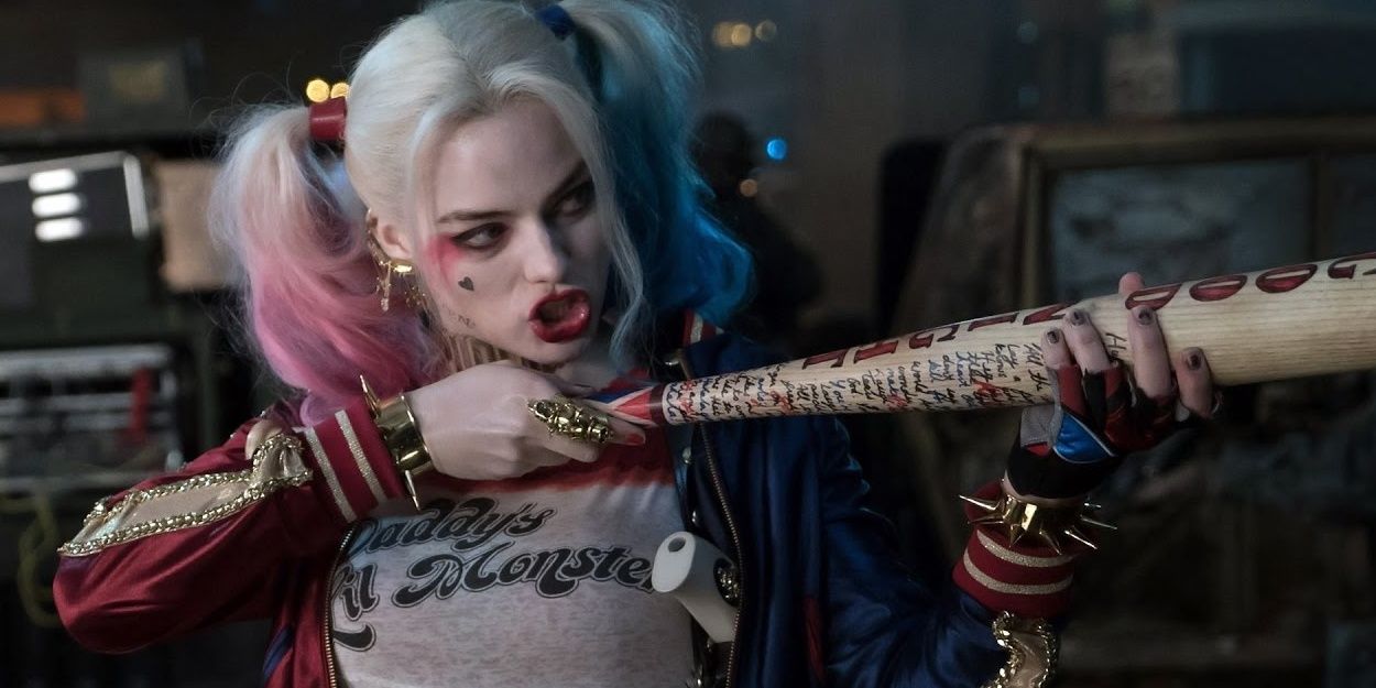 Harley Quinn aims her bat in a shooting position in Suicide Squad