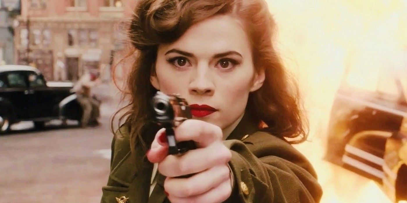 Hayley Atwell as Peggy Carter in Captain America First Avenger Aiming Gun At Camera