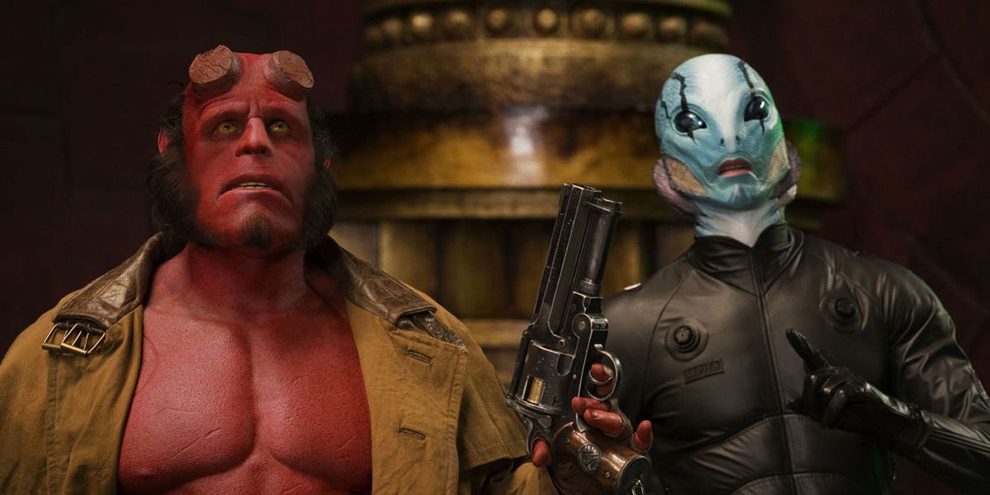 Hellboy holding up his gun with Abe Sapian.