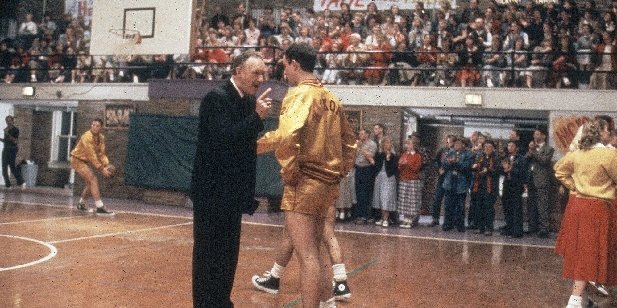 A coach pointing at a basketball player in Hoosiers