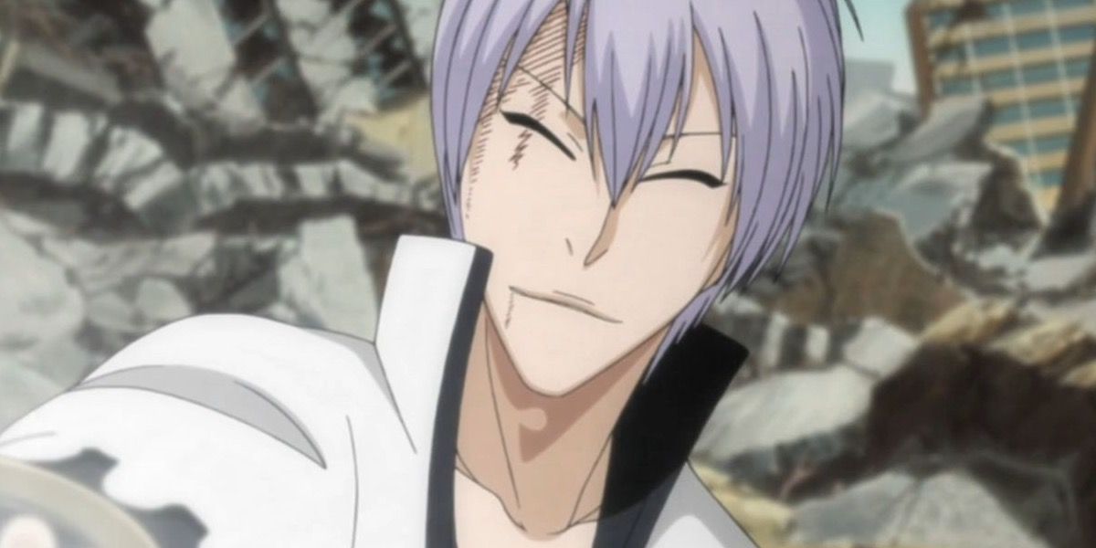 Ichimaru Gin smiling with rubble in the background in Bleach