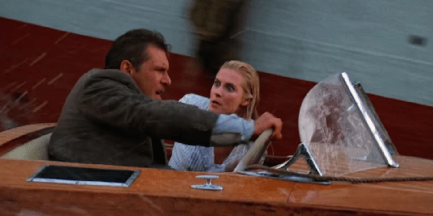 Indiana and Elsa escaping in the boat in The Last Crusade
