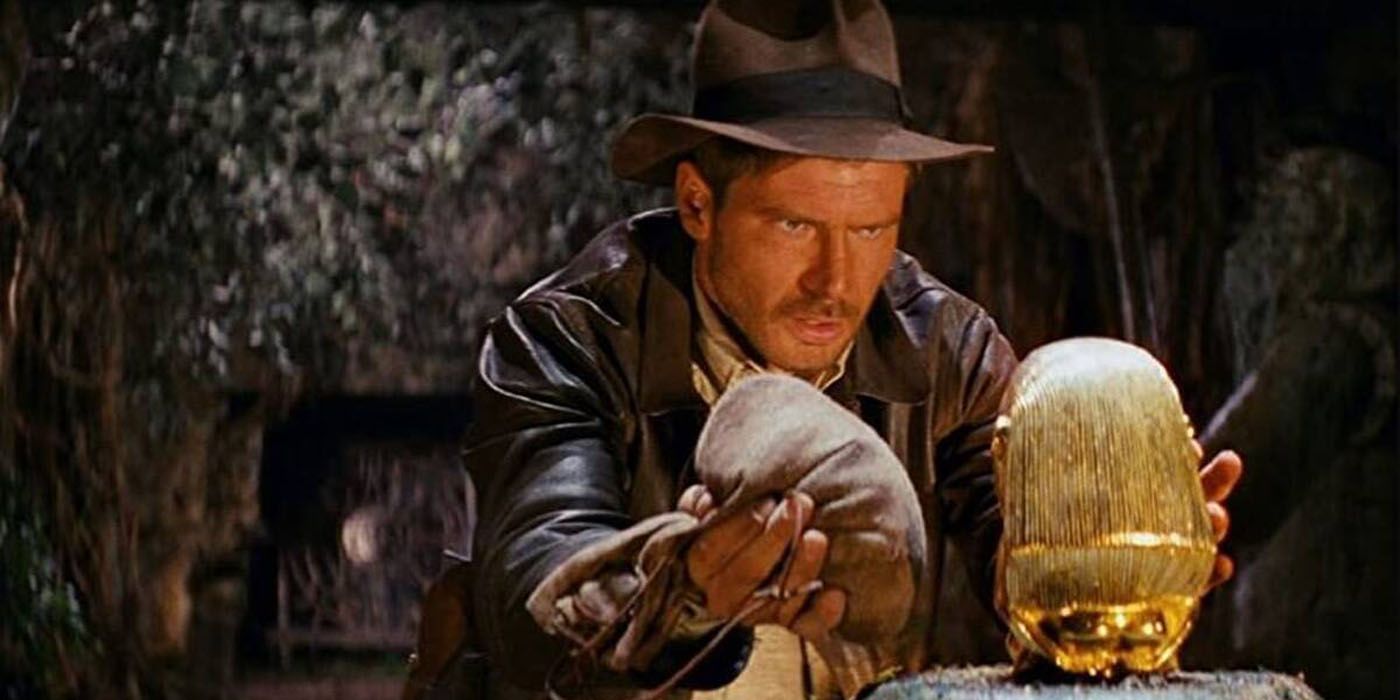 Indiana Jones grabbing treasure in Raiders of the Lost Ark.