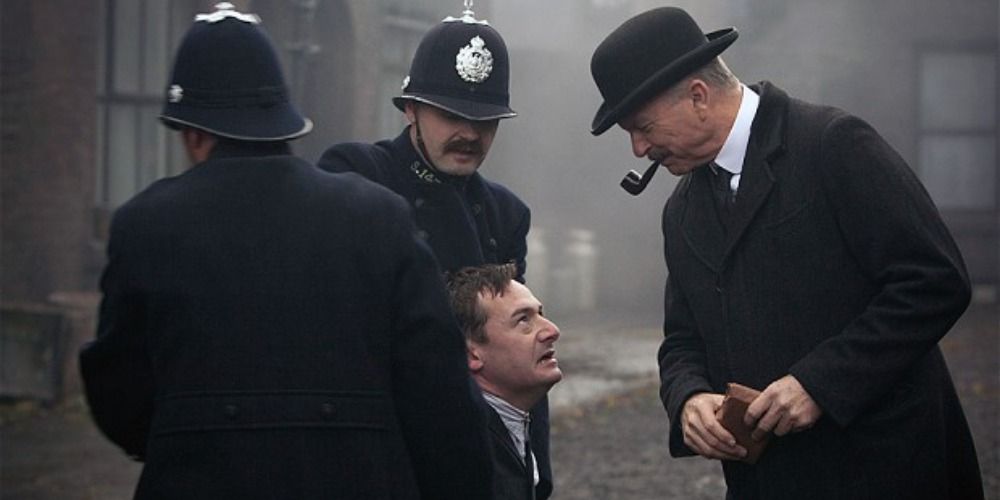 Campbell and his officers arrest the Communist Stanley Chapman in Peaky Blinders