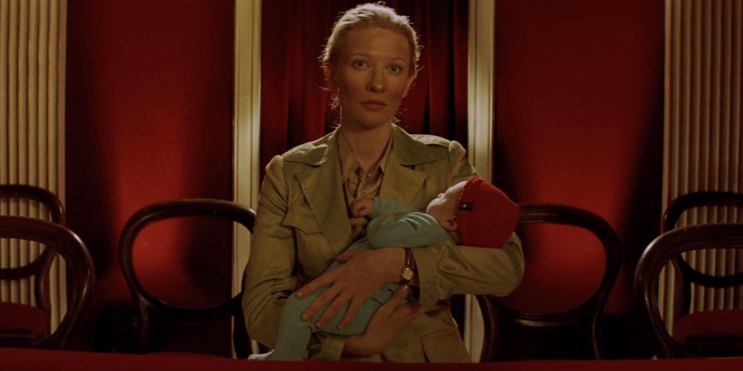 Jane holding her baby in a movie theater in The Life Aquatic.