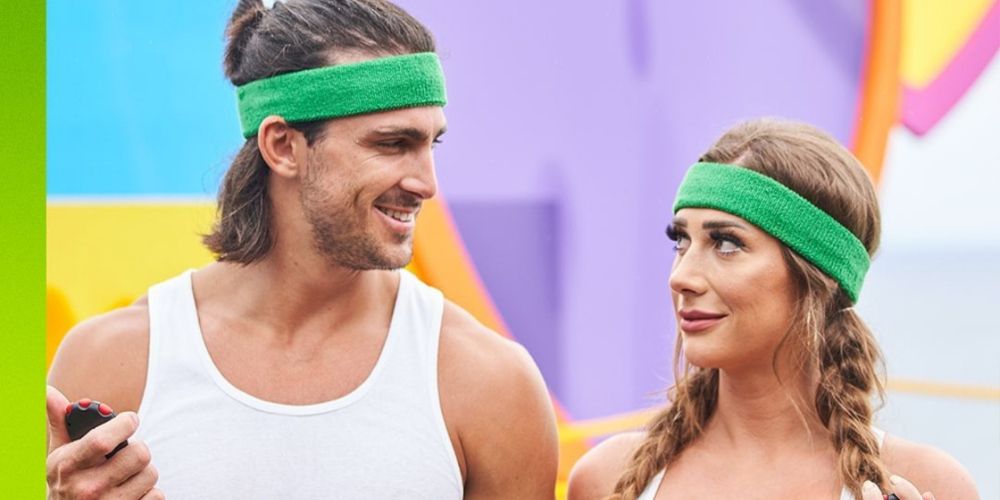 Jeremy and Olivia stare at each other while wearing green head bands n the third Season of Love Island USA