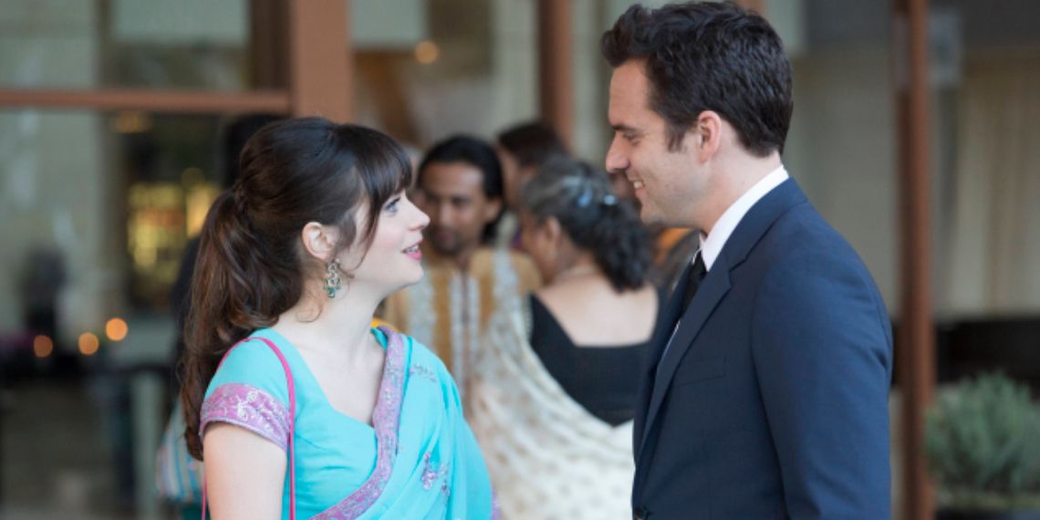 Jess and Nick stand together outside the venue for Ceces first wedding in New Girl