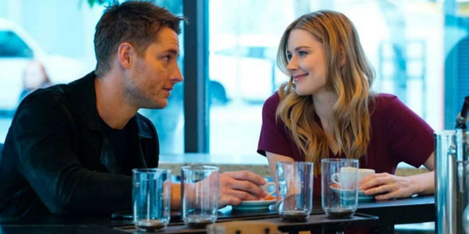 Kevin Pearson and Sophie smile at each other in a coffee shop in This Is Us.
