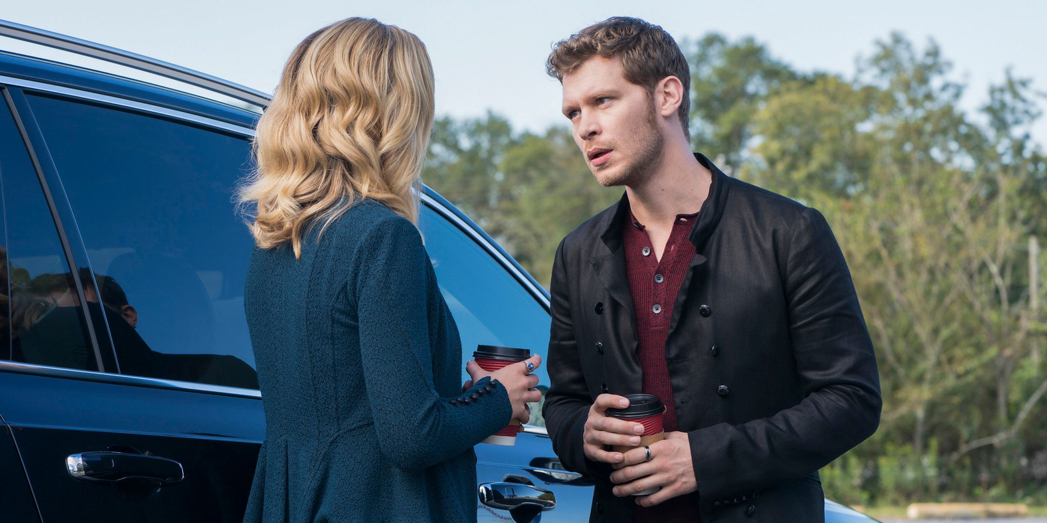 Klaus and Caroline holding coffee in The Originals.