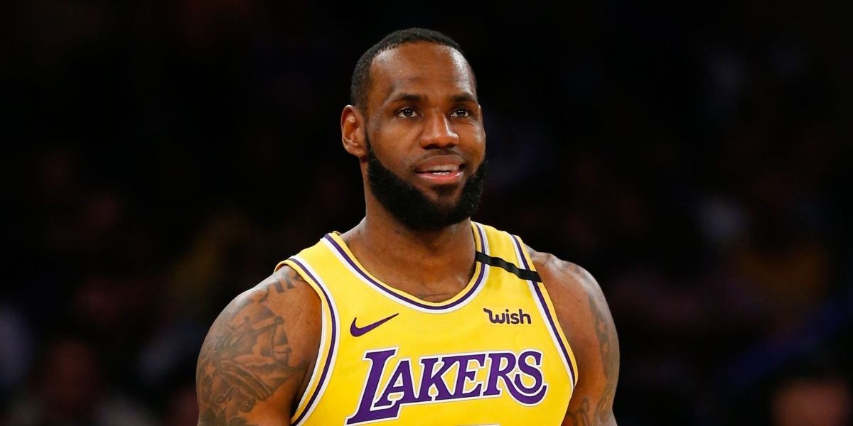 LeBron James smiling while on the Lakers' basketball court 