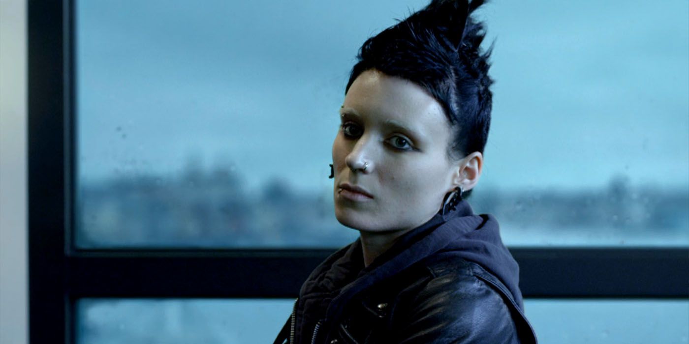 Lisbeth Salander sits by a window in The Girl with the Dragon Tattoo