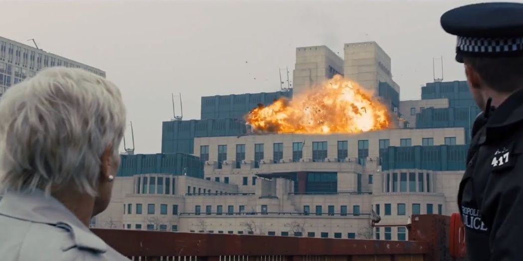 M watches the MI6 building explosion in Skyfall.