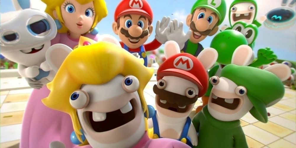 Mario and the Rabbids wave to the camera in the game Mario + Rabbids
