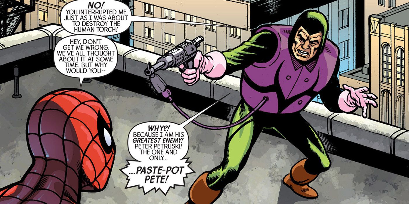 The Trapster aiming his Paste-Gun at Spider-Man on a rooftop